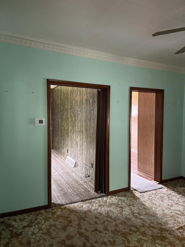 1026 Yeomans St, Ionia, MI 48846 - carpeted empty room with ceiling fan and crown molding