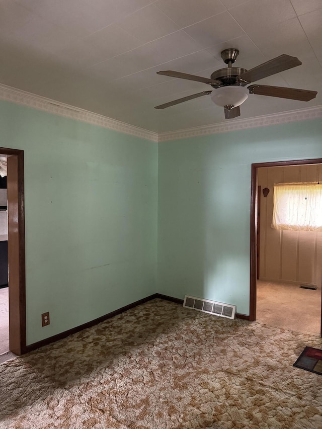 1026 Yeomans St, Ionia, MI 48846 - unfurnished room featuring carpet floors, a ceiling fan, and ornamental molding