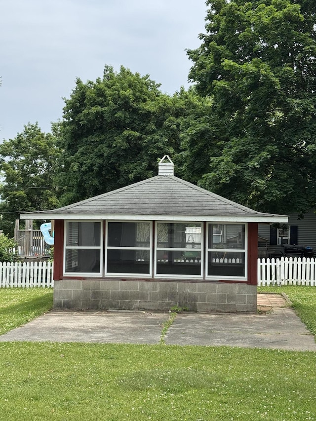 1026 Yeomans St, Ionia, MI 48846 - bungalow featuring concrete block siding and roof with shingles