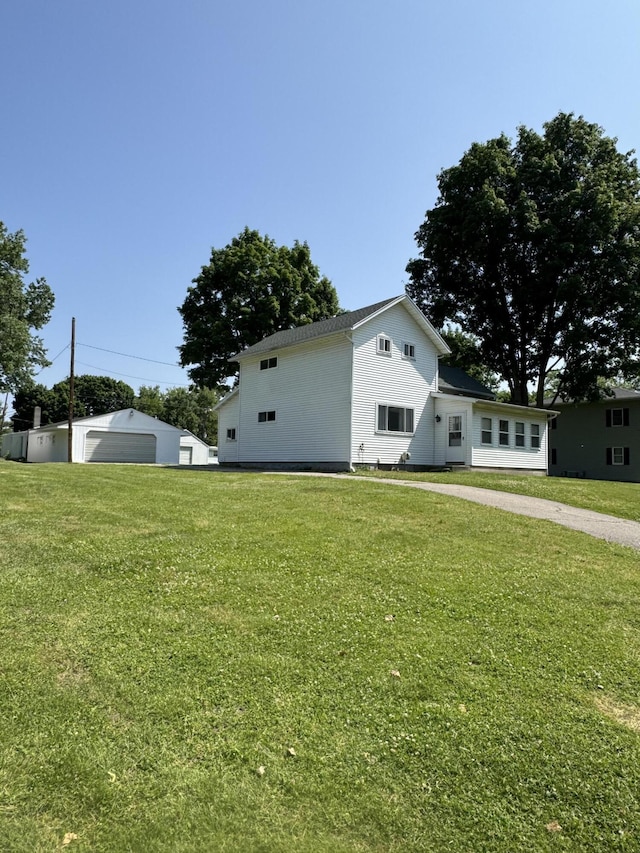 1026 Yeomans St, Ionia, MI 48846 - view of home's exterior featuring a yard