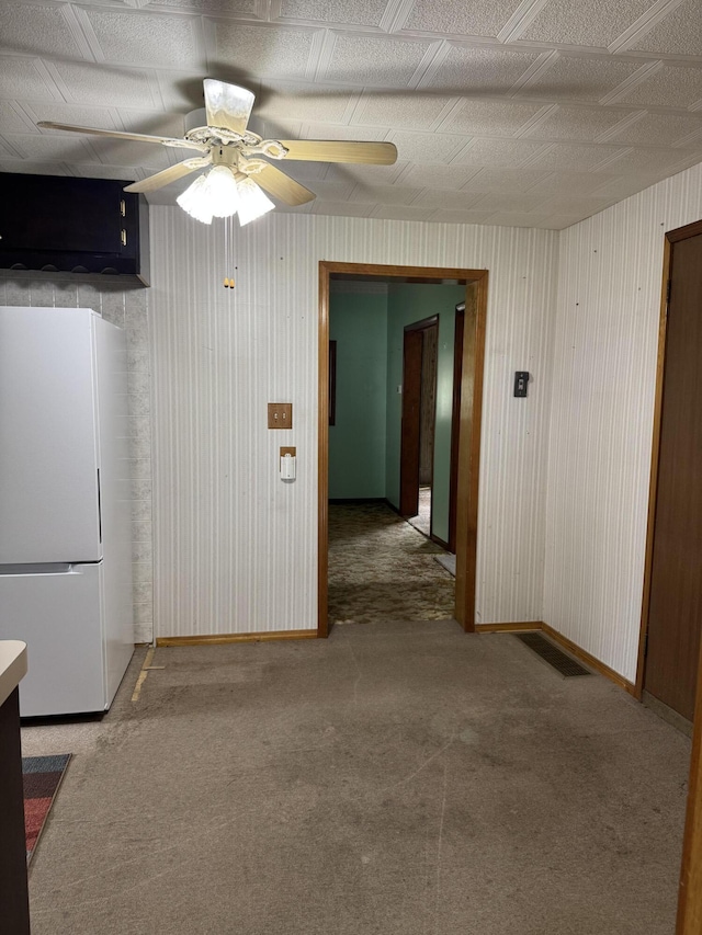 1026 Yeomans St, Ionia, MI 48846 - kitchen featuring freestanding refrigerator, carpet, and ceiling fan