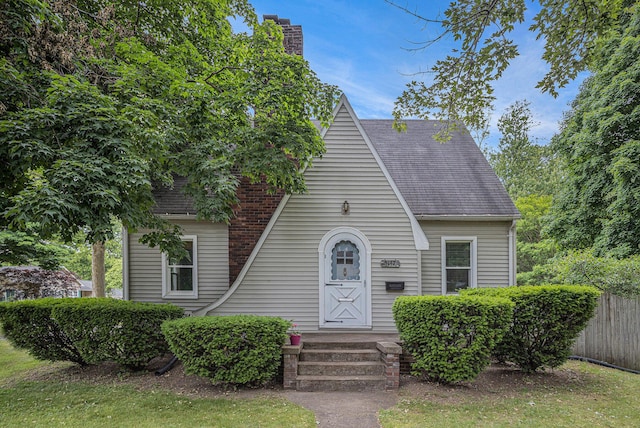 5147 N Riverview Dr, Kalamazoo, MI 49004 - view of front of home with a shingled roof and a chimney