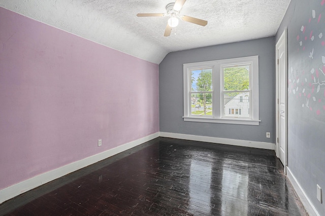 5147 N Riverview Dr, Kalamazoo, MI 49004 - unfurnished room featuring a textured ceiling, a ceiling fan, dark wood-style floors, and vaulted ceiling