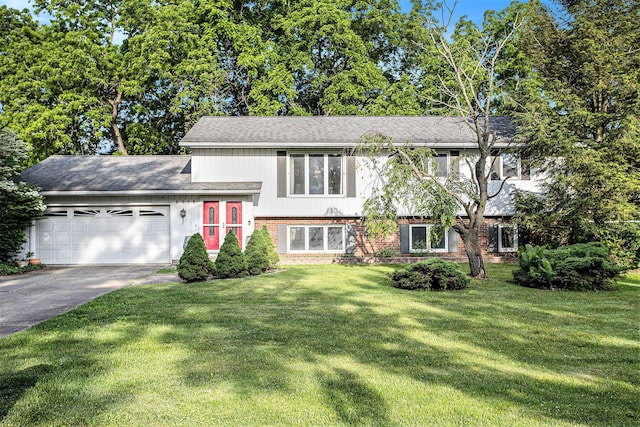 6958 Paddock Ln, Jackson, MI 49201 - tri-level home with brick siding, an attached garage, driveway, and a front lawn