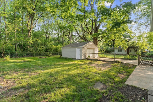 1334 Regent St, Niles, MI 49120 - fenced backyard featuring a storage shed and a detached garage