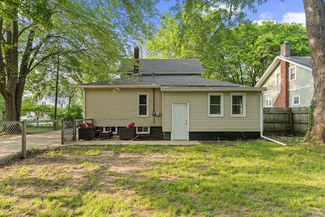 1334 Regent St, Niles, MI 49120 - rear view of house with an outdoor living space, a chimney, and a patio area
