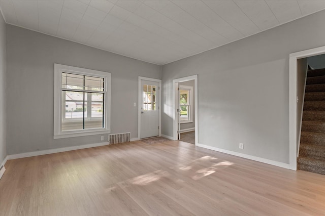 1334 Regent St, Niles, MI 49120 - unfurnished living room featuring plenty of natural light, stairway, and wood finished floors