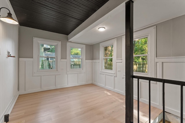 1334 Regent St, Niles, MI 49120 - spare room with a decorative wall, light wood-style floors, and a wainscoted wall