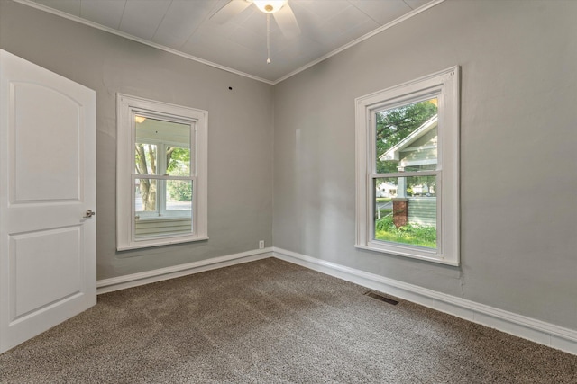 1334 Regent St, Niles, MI 49120 - empty room with dark carpet, healthy amount of natural light, crown molding, and ceiling fan