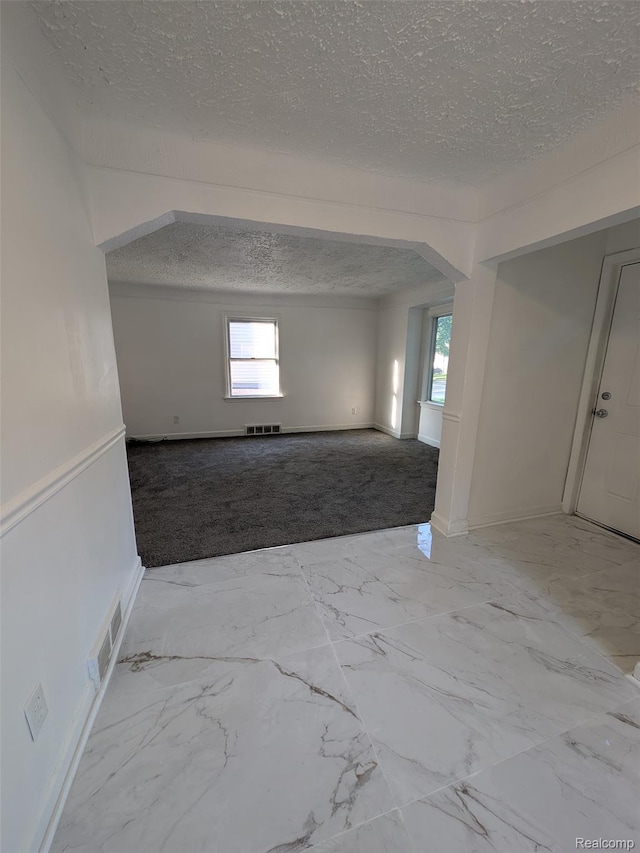 19947 Kinloch, Redford, MI 48240 - spare room with a textured ceiling, plenty of natural light, light carpet, and light marble finish floors