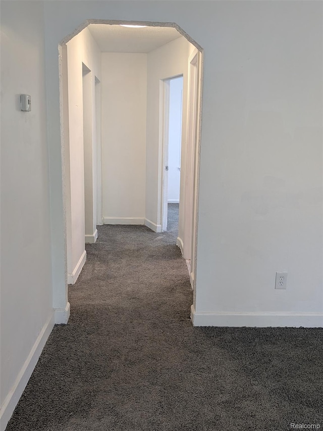 19947 Kinloch, Redford, MI 48240 - hallway featuring dark carpet and arched walkways