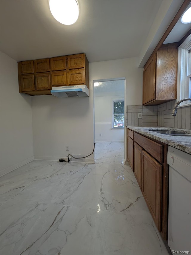 19947 Kinloch, Redford, MI 48240 - kitchen with dishwasher, under cabinet range hood, brown cabinets, and plenty of natural light