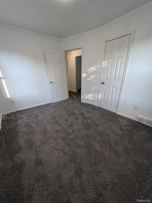 19947 Kinloch, Redford, MI 48240 - unfurnished bedroom featuring crown molding and dark colored carpet