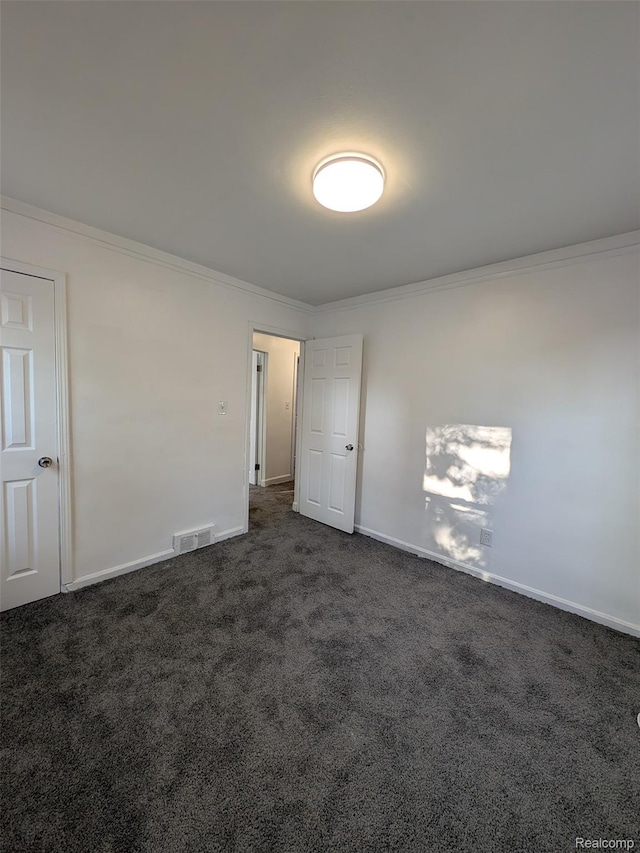 19947 Kinloch, Redford, MI 48240 - spare room with ornamental molding and dark carpet