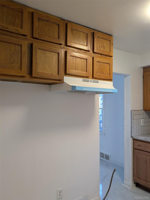 19947 Kinloch, Redford, MI 48240 - kitchen view of brown cabinetry, under cabinet range hood, and light countertops