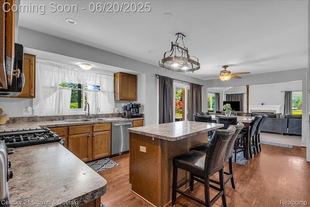 100 Mornington Ct, Canton, MI 48188 - kitchen with dishwasher, healthy amount of natural light, brown cabinetry, and ceiling fan