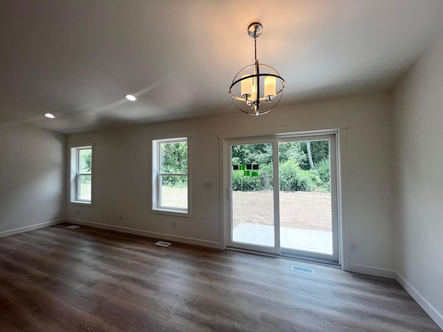 2959 Polaris Ave, Kalamazoo, MI 49004 - empty room with a chandelier, dark wood-type flooring, and recessed lighting