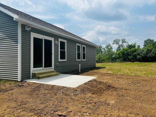 2959 Polaris Ave, Kalamazoo, MI 49004 - back of house featuring entry steps, a patio, and a shingled roof