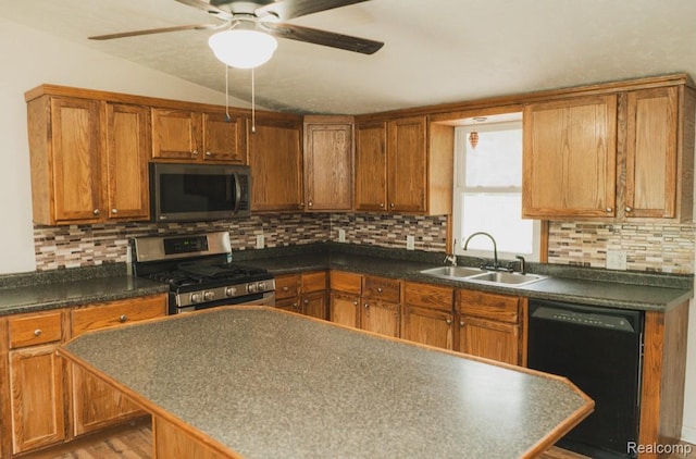 11709 Old Belding Rd NE, Belding, MI 48809 - kitchen with appliances with stainless steel finishes, ceiling fan, brown cabinets, decorative backsplash, and dark countertops