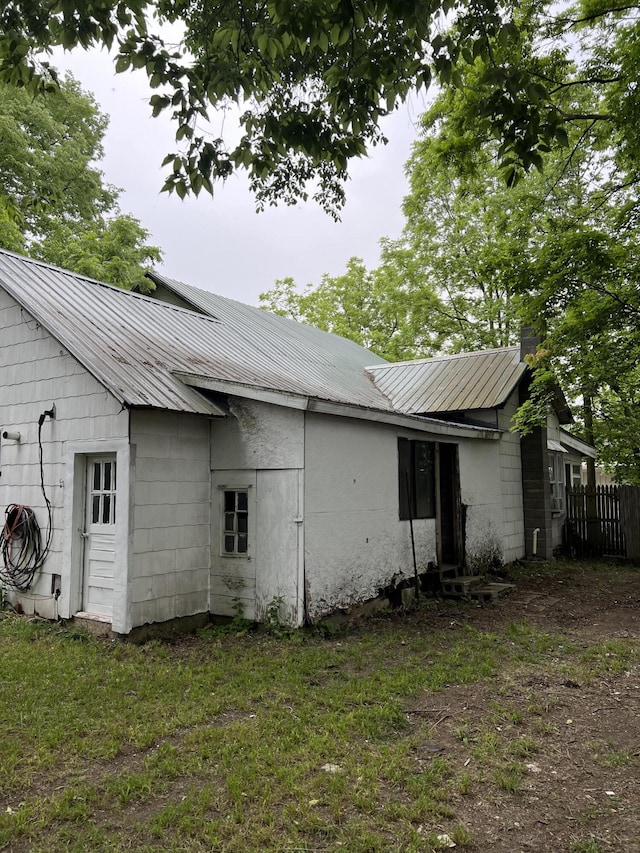 102 Allett St, Allegan, MI 49010 - view of property exterior with a metal roof