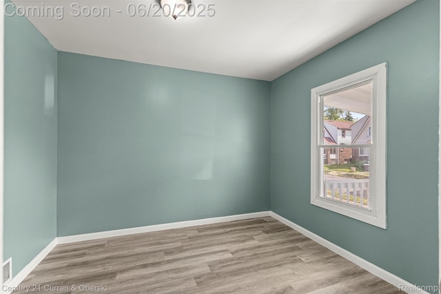 9045 Burnette St, Detroit, MI 48204 - unfurnished room featuring wood finished floors and baseboards