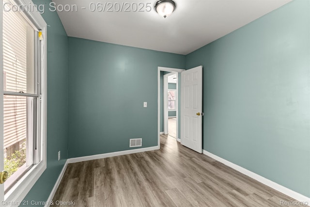 9045 Burnette St, Detroit, MI 48204 - empty room with wood finished floors and baseboards