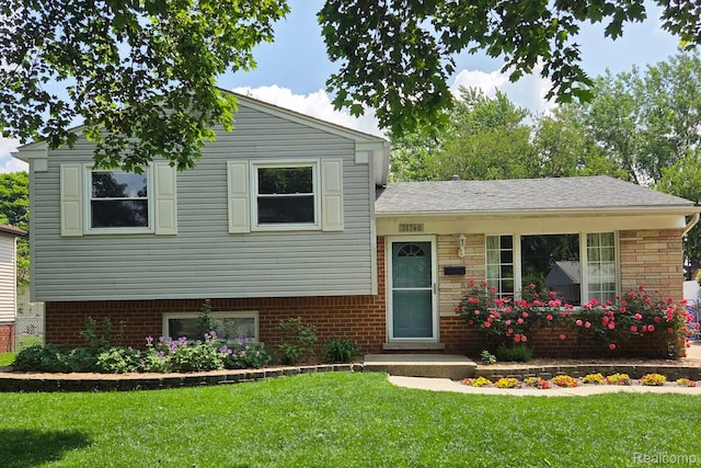 31740 Nelson Dr, Warren, MI 48088 - tri-level home featuring a front lawn and brick siding