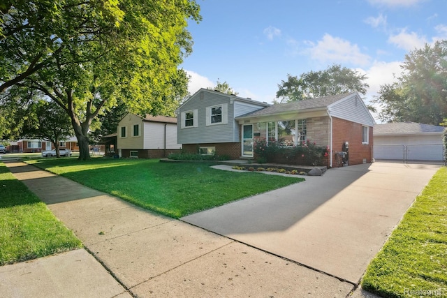 31740 Nelson Dr, Warren, MI 48088 - split level home featuring brick siding, a garage, an outbuilding, and a front yard