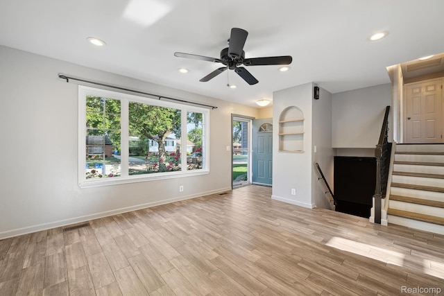 31740 Nelson Dr, Warren, MI 48088 - unfurnished living room with light wood-style flooring, ceiling fan, and recessed lighting
