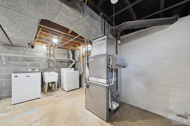 31740 Nelson Dr, Warren, MI 48088 - unfinished below grade area featuring washer and dryer and heating unit