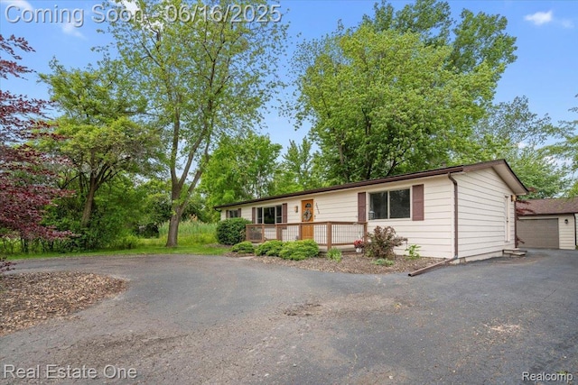 20558 Meridian Rd, Grosse Ile, MI 48138 - view of front of property with a deck and driveway