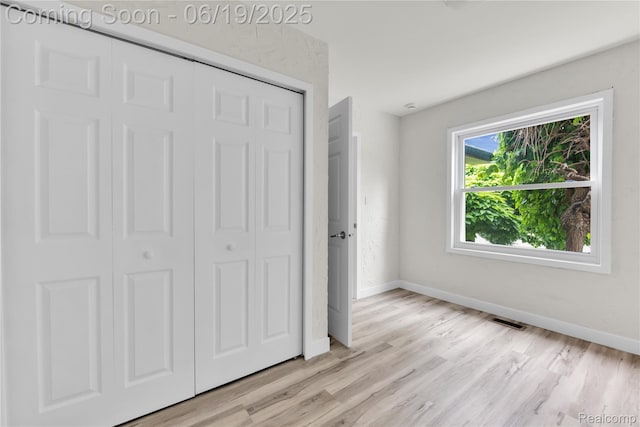 25044 Comfort, Center Line, MI 48015 - unfurnished bedroom featuring a closet and light wood-style flooring