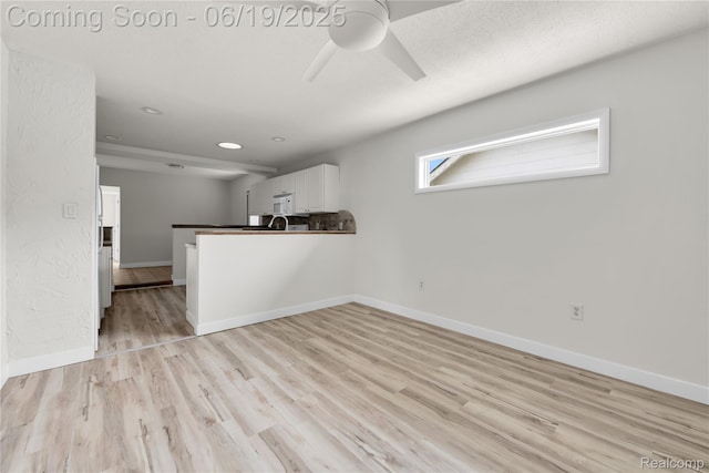 25044 Comfort, Center Line, MI 48015 - unfurnished living room with light wood finished floors, ceiling fan, and recessed lighting