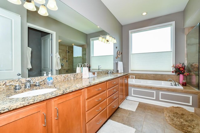 8734 Oakland Hills Cir Unit 6, Portage, MI 49024 - full bathroom with a stall shower, tile patterned floors, double vanity, a bath, and a chandelier