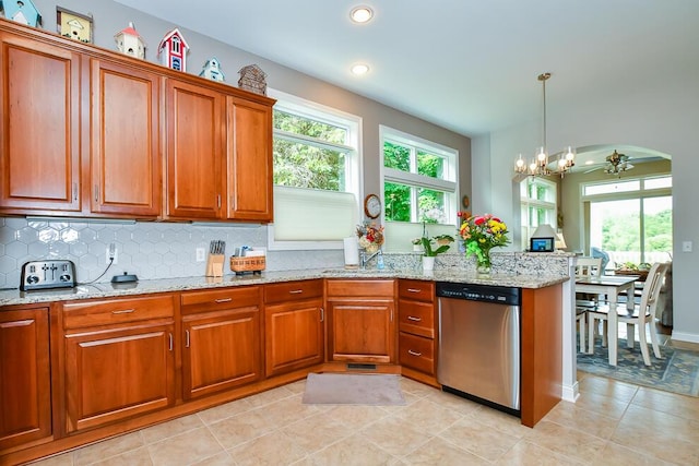 8734 Oakland Hills Cir Unit 6, Portage, MI 49024 - kitchen with stainless steel dishwasher, brown cabinets, plenty of natural light, and recessed lighting