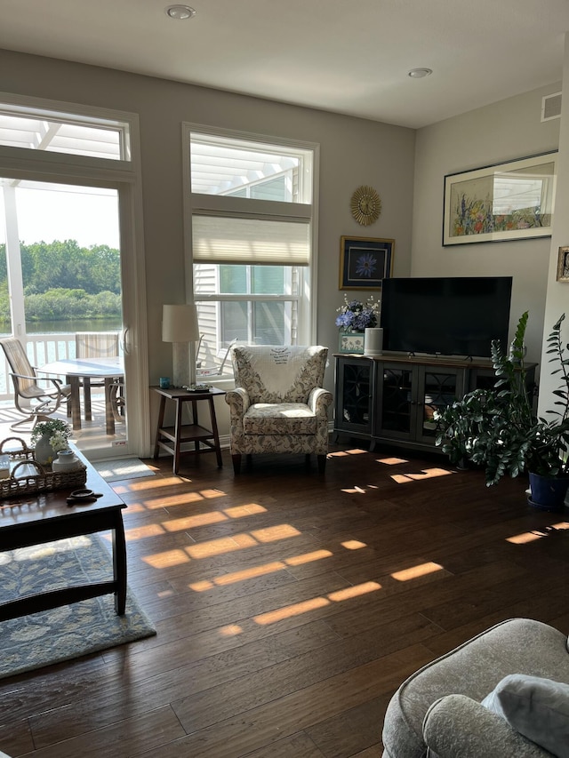 8734 Oakland Hills Cir Unit 6, Portage, MI 49024 - living room featuring wood-type flooring, recessed lighting, and a water view