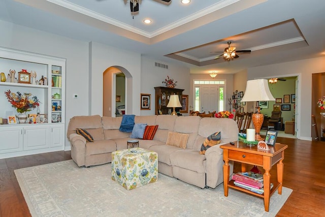 8734 Oakland Hills Cir Unit 6, Portage, MI 49024 - living area featuring ceiling fan, arched walkways, crown molding, a tray ceiling, and wood finished floors