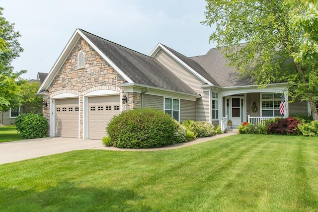 8734 Oakland Hills Cir Unit 6, Portage, MI 49024 - view of front facade featuring stone siding, covered porch, concrete driveway, a garage, and a front lawn
