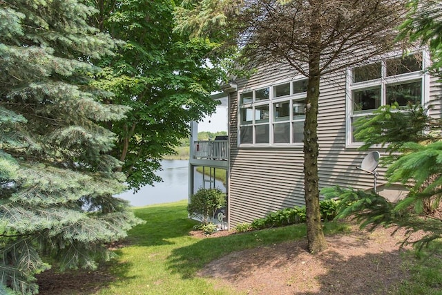 8734 Oakland Hills Cir Unit 6, Portage, MI 49024 - view of home's exterior with a water view and a lawn