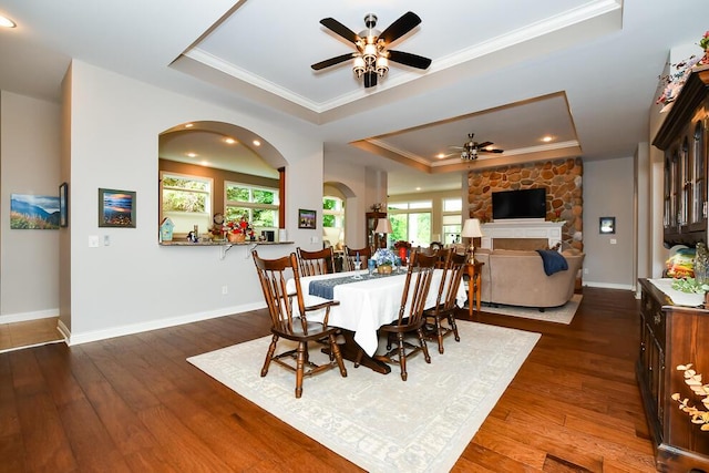 8734 Oakland Hills Cir Unit 6, Portage, MI 49024 - dining area featuring a tray ceiling, ceiling fan, ornamental molding, arched walkways, and hardwood / wood-style flooring