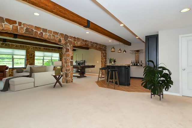 8734 Oakland Hills Cir, Portage, MI 49024 - living room featuring a bar, light carpet, beamed ceiling, recessed lighting, and arched walkways