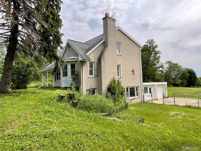3615 N Mill Rd, Dryden, MI 48428 - view of side of home with a chimney, a garage, and brick siding