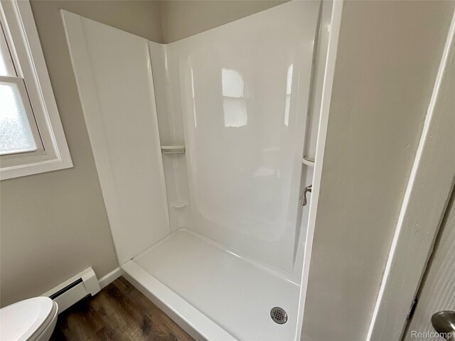 3615 N Mill Rd, Dryden, MI 48428 - full bath featuring a baseboard radiator, walk in shower, and wood finished floors