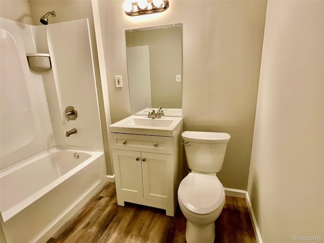 3615 N Mill Rd, Dryden, MI 48428 - bathroom featuring wood finished floors, vanity, and bathing tub / shower combination