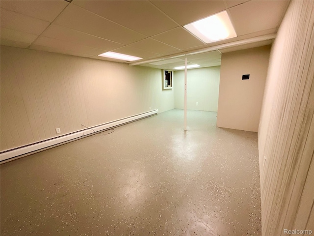 3615 N Mill Rd, Dryden, MI 48428 - finished below grade area featuring a baseboard heating unit and a drop ceiling
