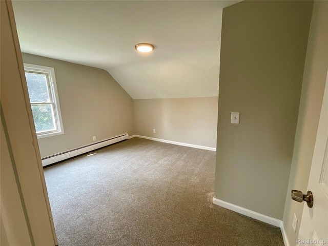 3615 N Mill Rd, Dryden, MI 48428 - bonus room featuring baseboard heating, dark colored carpet, and vaulted ceiling