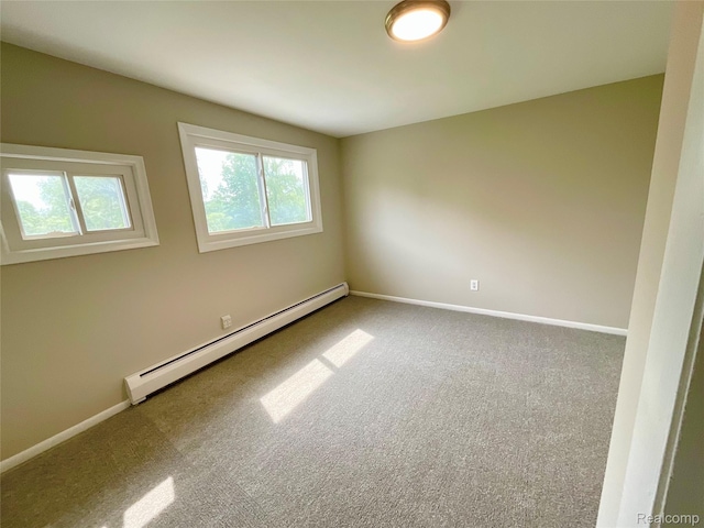 3615 N Mill Rd, Dryden, MI 48428 - empty room with a baseboard radiator and carpet
