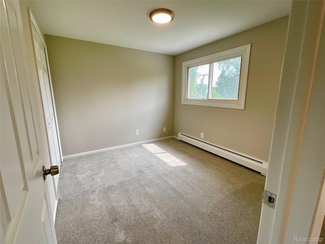 3615 N Mill Rd, Dryden, MI 48428 - carpeted spare room featuring a baseboard radiator and baseboards