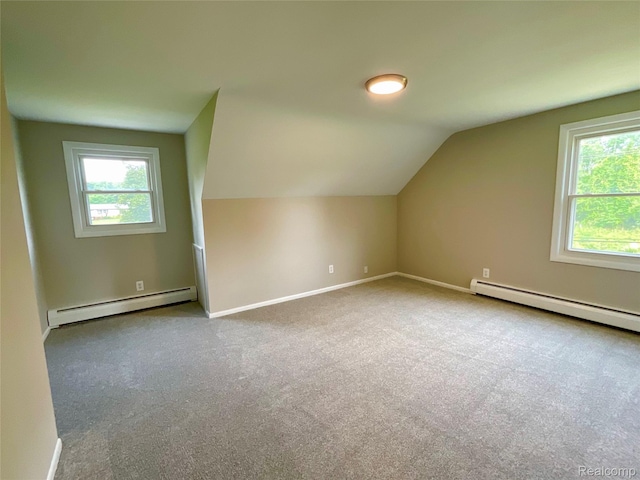 3615 N Mill Rd, Dryden, MI 48428 - additional living space featuring a baseboard radiator, lofted ceiling, and carpet floors