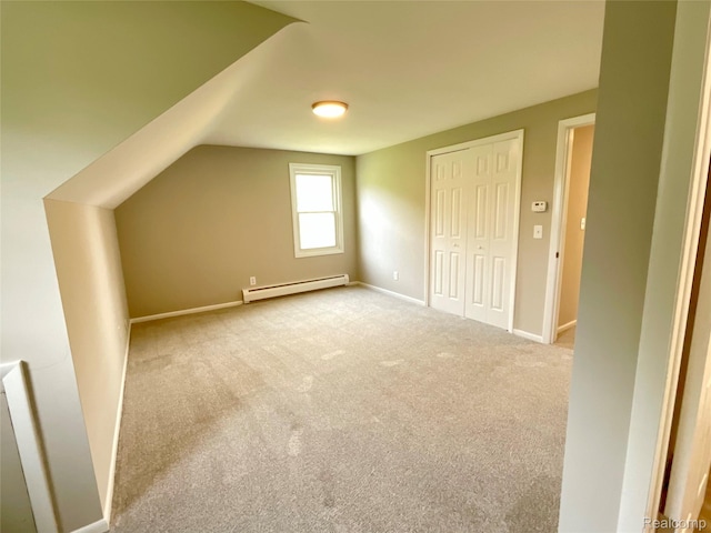 3615 N Mill Rd, Dryden, MI 48428 - additional living space with baseboard heating, carpet, and vaulted ceiling